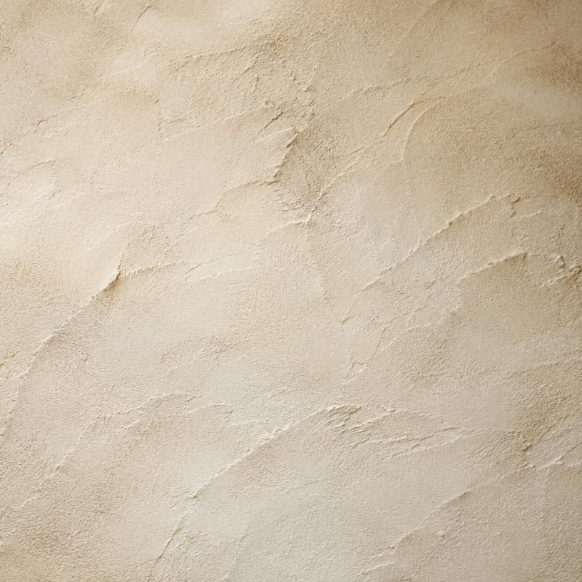 Close-up of hand-troweled Santa Barbara stucco finish in warm cream